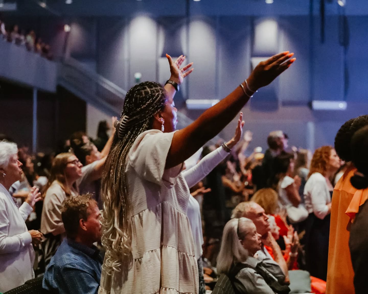 Young worshipper receiving prayer at To·Gather