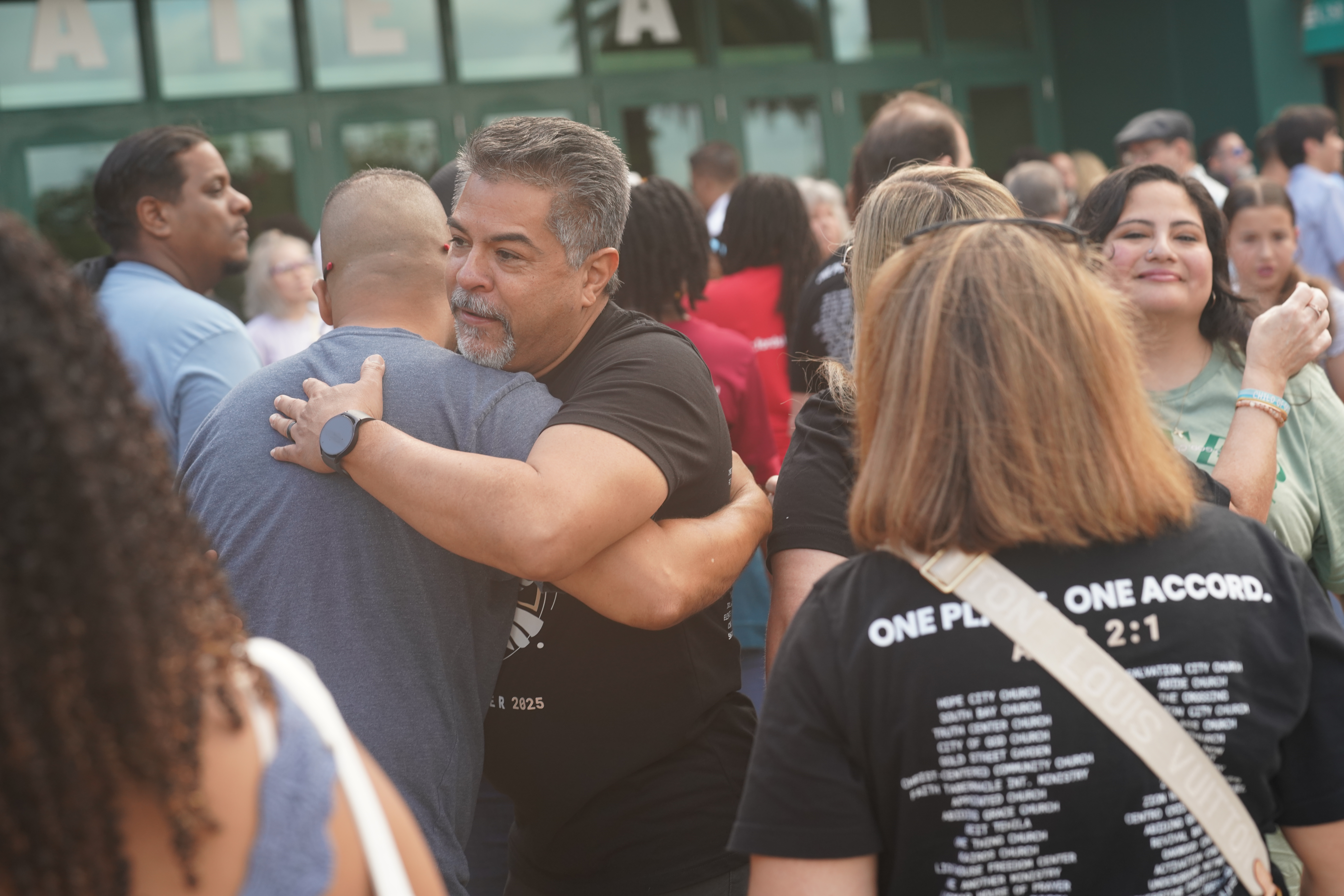 Brothers embracing at To·Gather