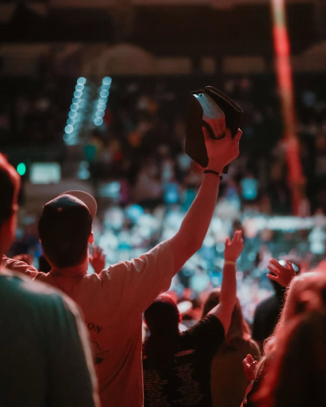 Crowd with hands raised in worship