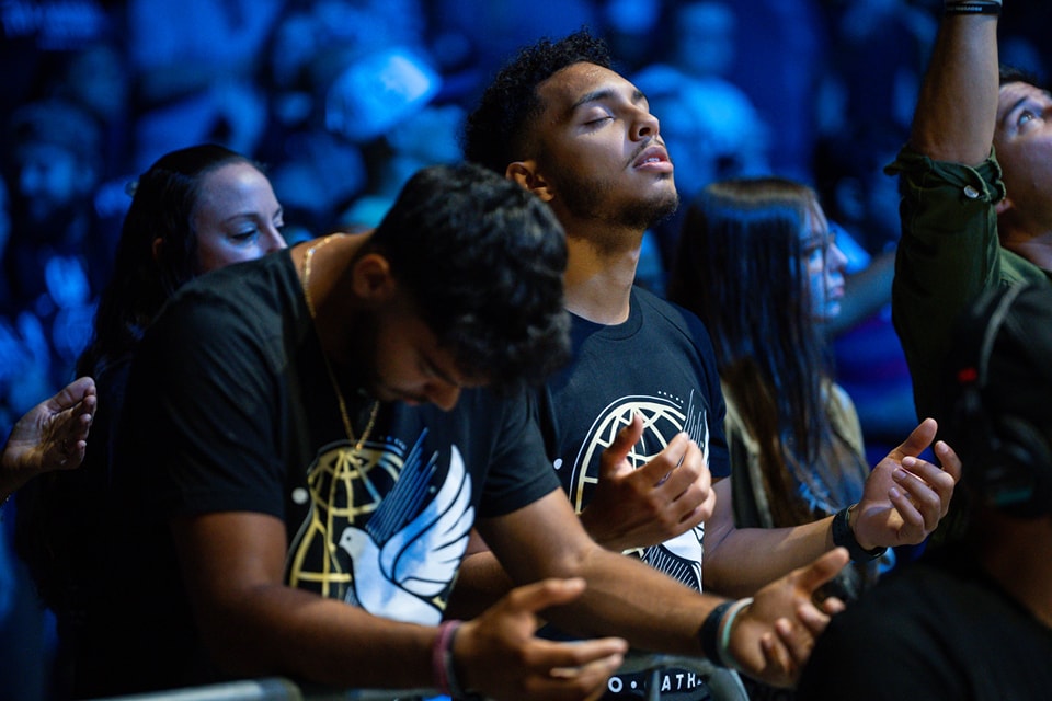 Young man worshipping at To·Gather